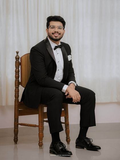 A classic portrait of the groom, looking dapper and ready to meet his bride. Capturing these individual moments of anticipation is part of telling the complete wedding story.