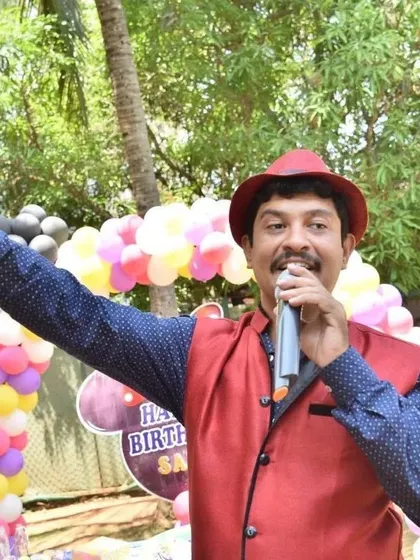 This is me in my element: microphone in hand, engaging the crowd, and making sure the energy is always high. This photo captures the interactive style I bring to every birthday party and event.