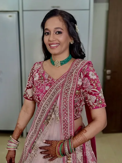 A soft and graceful look for this beautiful bride. Her pink and white lehenga was paired with natural makeup and gentle waves for a fresh, daytime wedding.