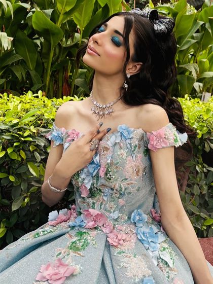 A full-on Barbiecore fantasy. This look is all about pinks, sparkles, and bold lashes.