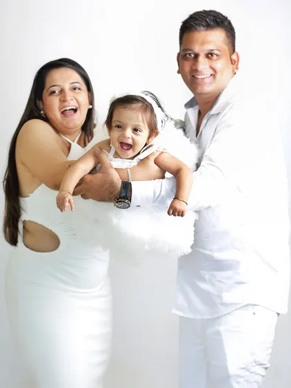Pure, spontaneous joy. This candid shot of a family laughing together is what it's all about. These unposed moments often make for the most memorable photographs.