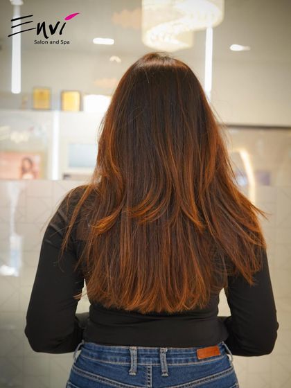 The back view of a perfectly executed layered cut. Notice the clean lines and healthy ends, the foundation of any great hairstyle.