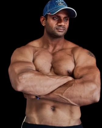 Showing the results of consistent arm and chest workouts. Building a powerful upper body requires focus and proper form.