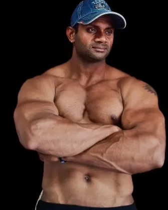 Arms crossed, confident pose.