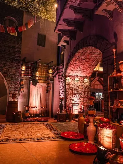 A quiet corner in the Arabian souk, featuring traditional rugs, pottery, and soft, warm lighting. I design these spaces to ensure every part of the venue is a photo-worthy experience.