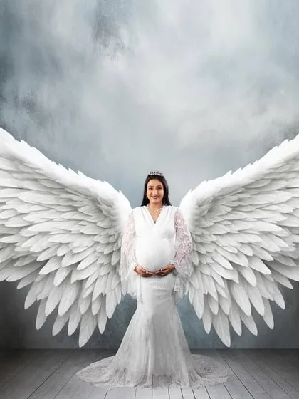 For a truly magical memory, I create fine art portraits like this one. With beautiful angel wings and dramatic lighting, I can turn your maternity photo into a breathtaking piece of art that feels truly special.