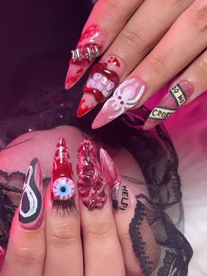 When a client says "go wild for Halloween," I deliver. This set features incredibly detailed, hand-sculpted 3D nail art, including a brain texture, a bloody eyeball with real lashes, and even a Ghostface design. This is for you if you want your nails to be the main event.