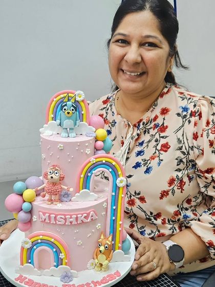 Me with the finished Bluey cake. I was so happy with how this one turned out!