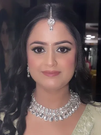 A beautiful portrait of our Sagan bride. The makeup is clean and fresh, with a focus on flawless skin, defined brows, and a soft nude pink lip.