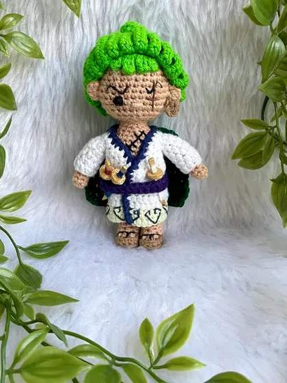 Roronoa Zoro from One Piece in a different outfit. This version features his white kimono, green cape, and of course, his three swords. It's always exciting to create new designs for a character.