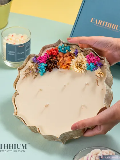 This precious piece from my luxury collection features a large, sculpted candle plate adorned with a rainbow of dried flowers.