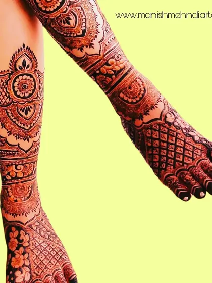 Bridal mehndi isn't just for the hands. We create stunning, full-leg designs that complement your entire bridal look. This intricate pattern covers the legs with beautiful traditional motifs, ensuring you look perfect from head to toe.