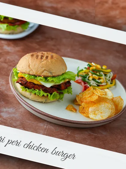Our Peri Peri Chicken Burger is packed with flavor. A juicy chicken patty, fresh lettuce, and our special sauce, all served with a side of crispy chips.