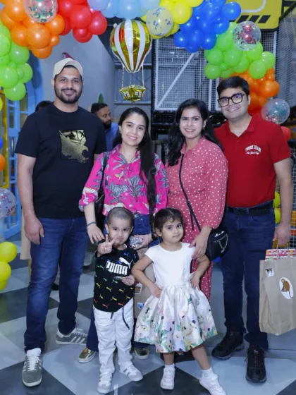 A group of families enjoying a birthday celebration together. The more, the merrier!