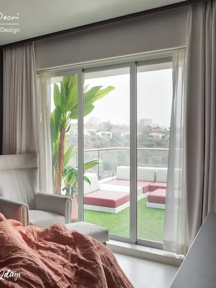 Waking up to this view is a luxury in itself. This shot from the master bedroom of Project 22 Days shows the seamless transition from a cozy indoor space to an expansive outdoor lounge area.