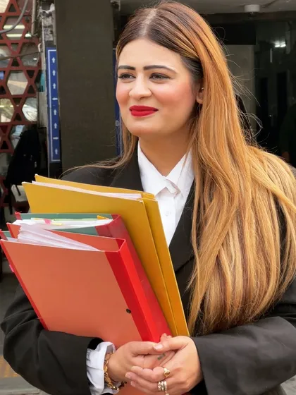 The reality of litigation is in the details. Here I am, files in hand, fully prepared with the paperwork and research necessary to build a strong case. Every page represents hours of dedication to my client's cause.