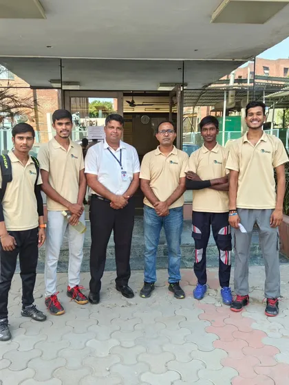 The GGems team and coaches outside the venue for the university-level squash event in Noida.
