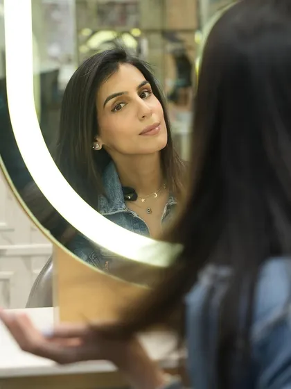 The final reveal. That moment when a client sees her transformed self in the mirror is what the Noir experience is all about: confidence, beauty, and self-love.