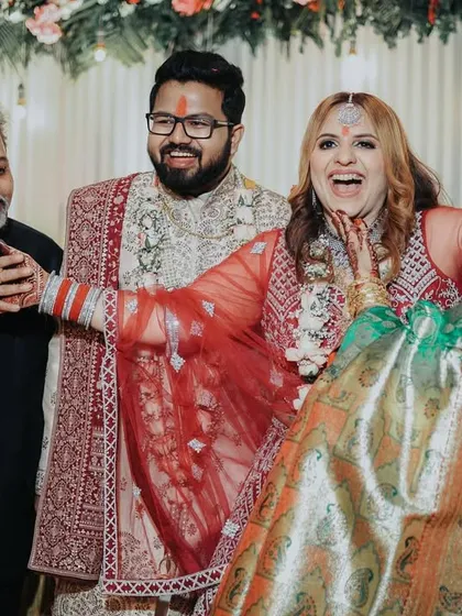 A heartwarming family moment filled with laughter and joy. These candid family interactions are just as important as the couple's portraits.