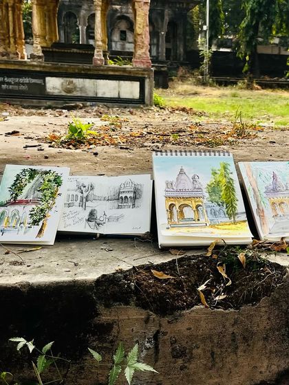 Another view of the sketchbooks lined up at our Nagpur sketch meet. So much creativity in one place.