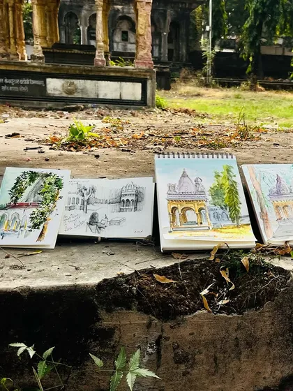 Another view of the sketchbooks lined up at our Nagpur sketch meet. So much creativity in one place.