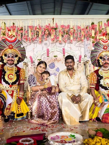 A unique naming ceremony where tradition meets folk art. The family is joined on stage by Yakshagana performers, adding a vibrant cultural element to the celebration, all framed by my traditional decor.