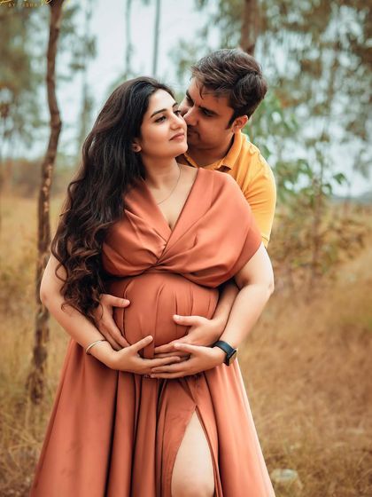 A loving embrace during an outdoor maternity session. I focus on poses that feel natural and highlight the couple's connection.