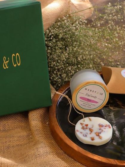 The 'Radiant Diwali Treasures Gift Box'. This hamper includes a selection of my artisanal soaps, a bubble candle, and a scented wax tablet.