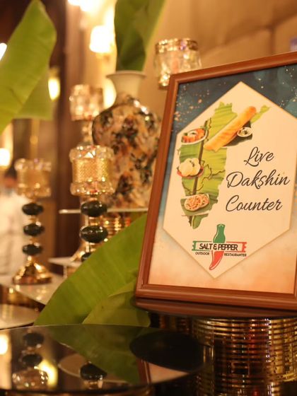 A sign for my 'Live Dakshin Counter', showcasing my ability to provide authentic and fresh South Indian cuisine as part of a diverse menu for any event.