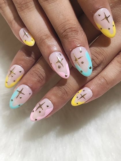 A full set view of the playful pastel star nails, perfect for a fun and whimsical look.
