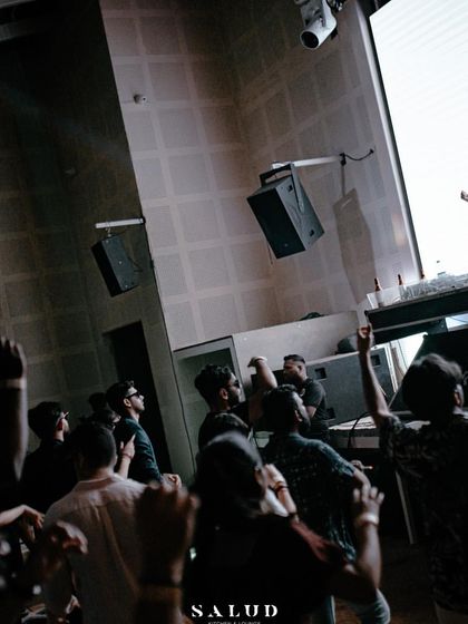 A shot from above, showing me hyping up the crowd at Salud. The energy is flowing from the stage to the floor.