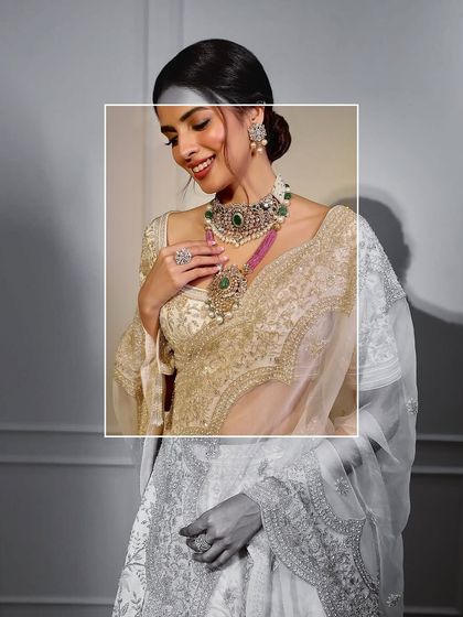 Some brides whisper, others make a statement. This maximalist bridal look with a stacked emerald and pearl necklace is for the bride who wants to shine.