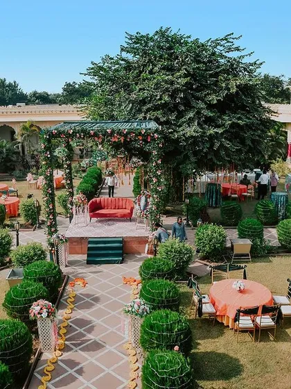 We believe the setting is a character in your story. This wide shot of a destination mehendi ceremony at a palace shows how we capture the scale and beauty of your venue, ensuring the atmosphere of your day is remembered forever.