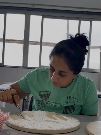 Here I am, lost in the flow of creation. Using a palette knife, I shape and sculpt the texture paste, turning a simple material into a piece that speaks of light and love.