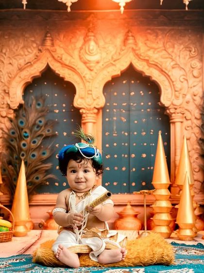 A slightly different pose, capturing the playful spirit of the baby in the Krishna costume.