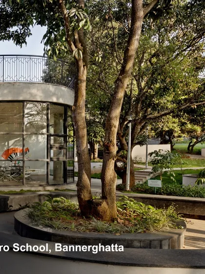 At Euro School, Bannerghatta, we integrated the building with the landscape. The design preserves existing trees and uses curved forms to create soft, inviting spaces that harmonize with nature, reflecting our commitment to sustainable design.