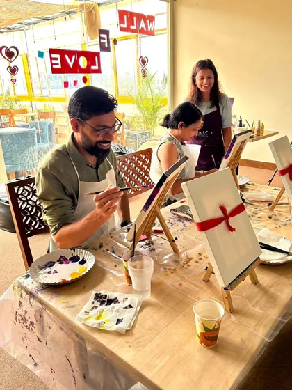 A couple enjoys a Valentine's Day paint date, guided by our instructor. It's a wonderful way to spend quality time together, creating something beautiful side by side.