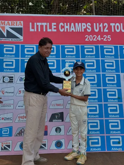 Another one of my young champions receiving his trophy at the U-12 Little Champs Tournament. Age-group cricket is the foundation, and I am proud to see my players excel.