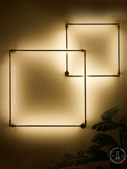Embrace minimalist design with these geometric square wall sconces. The clean lines and soft, indirect backlighting create a subtle yet striking artistic statement, perfect for adding ambient light to hallways, bedrooms, or modern living areas.