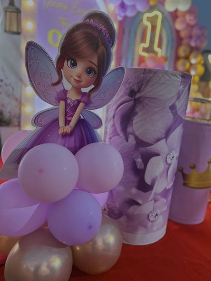 Details matter. This shot highlights the custom fairy cutout and the floral-patterned plinth we used for the cake stand, tying the whole princess theme together beautifully.