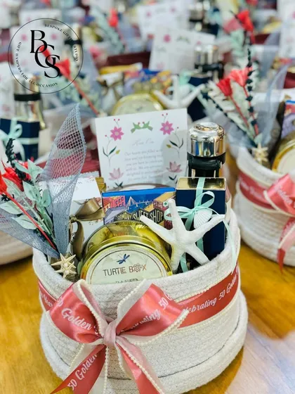 These custom hampers were created for a golden jubilee celebration in Goa. The beach-themed elements, like the starfish, and the personalized "50 Golden" ribbon perfectly captured the spirit of the event.