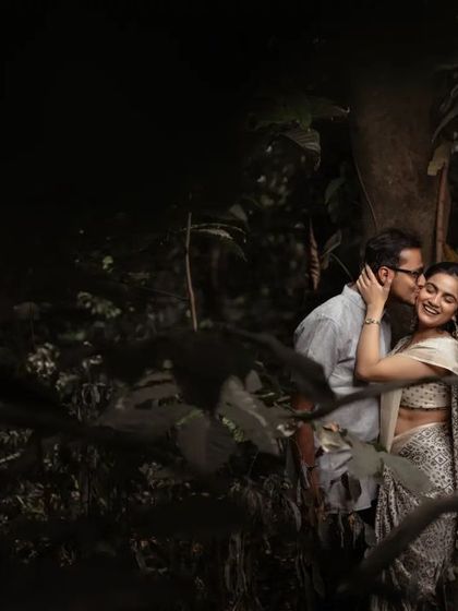 A romantic and moody pre-wedding portrait in a forest. We use the natural environment to create a sense of intimacy and drama.
