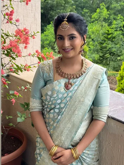 A happy, smiling Jahnavi. The makeup is designed to be long-lasting and comfortable for the entire event.