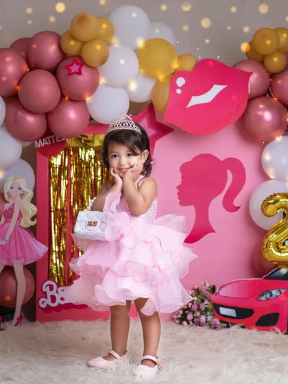 A duplicate of 305, showing the adorable birthday girl in her pink Barbie world.