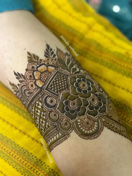 Another detailed armband for Sana, with a mix of geometric and floral elements.