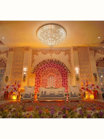 A wide shot of the magnificent wedding stage decor before the ceremony begins. I always make sure to capture the beautiful details and grandeur of the venue.