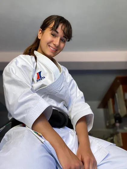 Martial arts builds more than just strength; it builds confidence. Here is one of our dedicated black belt students, embodying the calm and self-assured spirit that comes from years of disciplined training.