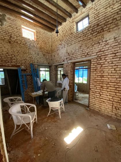 The start of a restoration project on a 100-year-old villa. Here, we've carefully removed the old plaster to expose the original brickwork, preserving the beautiful old rafters while planning for a new, thoughtful layout.