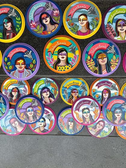 The full set of 28 hand-painted mini plates, laid out to show the wonderful diversity of the team.