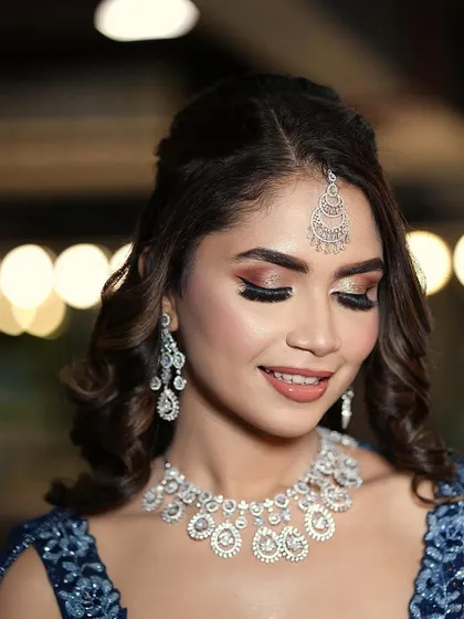 A close-up of the sangeet makeup, featuring a beautiful blend of glittery eyeshadow and a soft, natural lip.